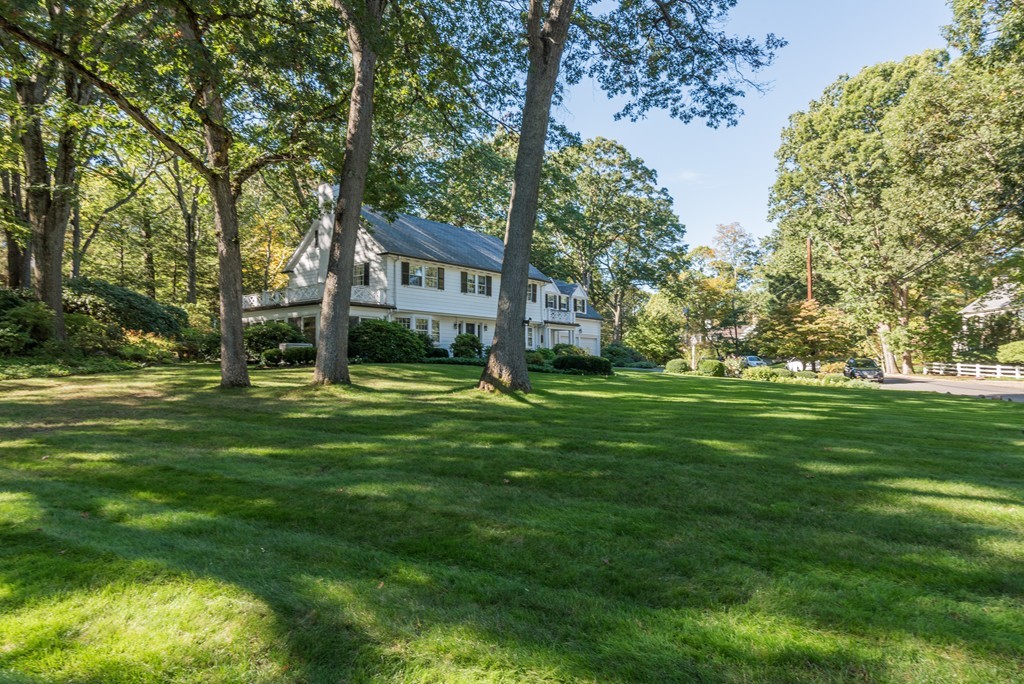 80 Dean Road Weston, MA 02493 - Photo 3 of 28 a front view of a house with a garden