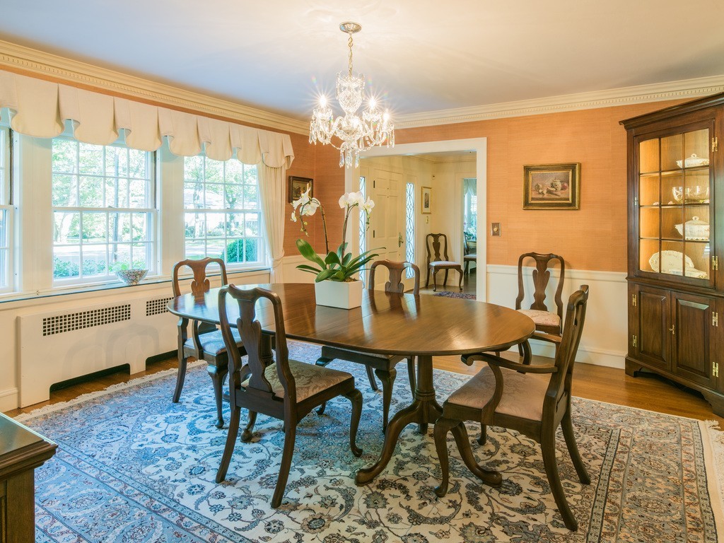 80 Dean Road Weston, MA 02493 - Photo 6 of 28 a dining room with furniture a chandelier and wooden floor