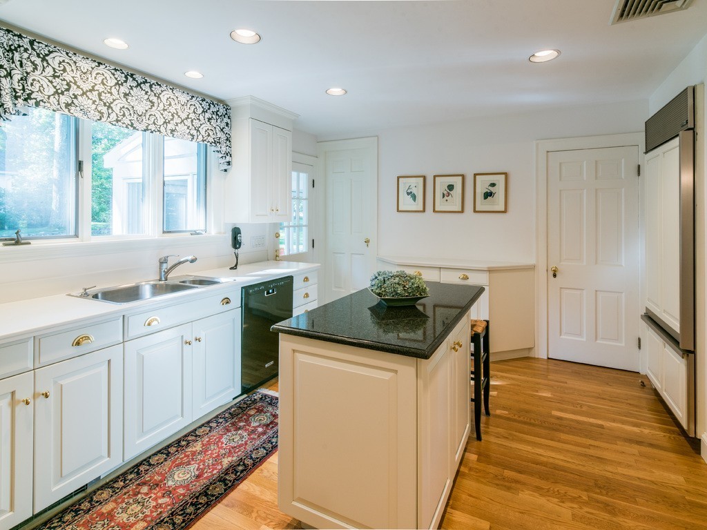 80 Dean Road Weston, MA 02493 - Photo 9 of 28 a kitchen with stainless steel appliances granite countertop a sink and a stove with wooden floor