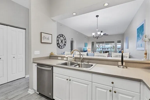 a kitchen with a sink and a window