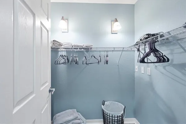 a bathroom with a toilet and shower curtain