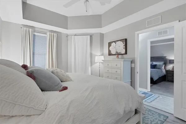 a bedroom with a bed and a view of bedroom