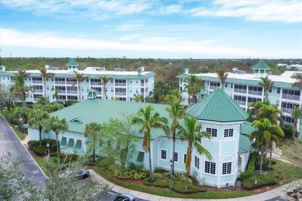 a aerial view of multiple houses with a yard