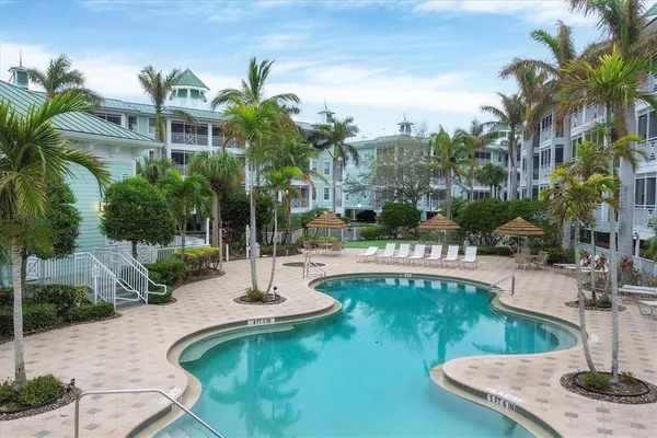 a view of a swimming pool with a patio