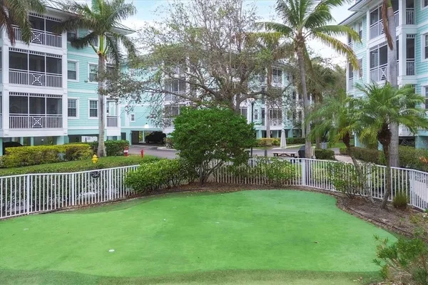 a view of a house with a yard and plants