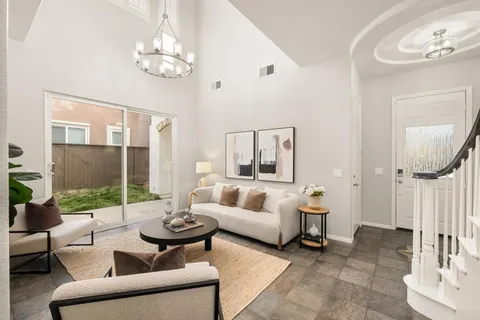 a dining room with furniture window and wooden floor