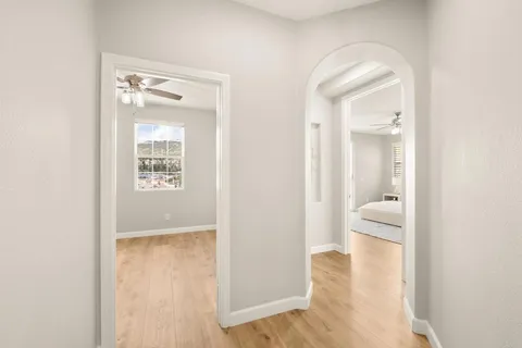 a spacious bathroom with a double vanity sink a mirror and a bathtub