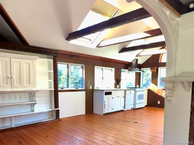 a backyard of a house with yard and outdoor seating