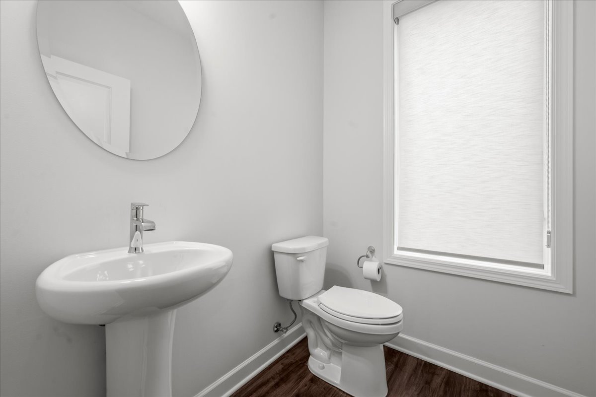 1229 Shermer Road Northbrook, IL 60062 - Photo 12 of 22 a bathroom with a toilet a sink and mirror