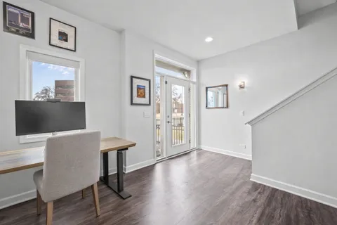a view of a livingroom with furniture and wooden floor
