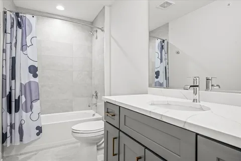 a bathroom with a sink a toilet and a bathtub