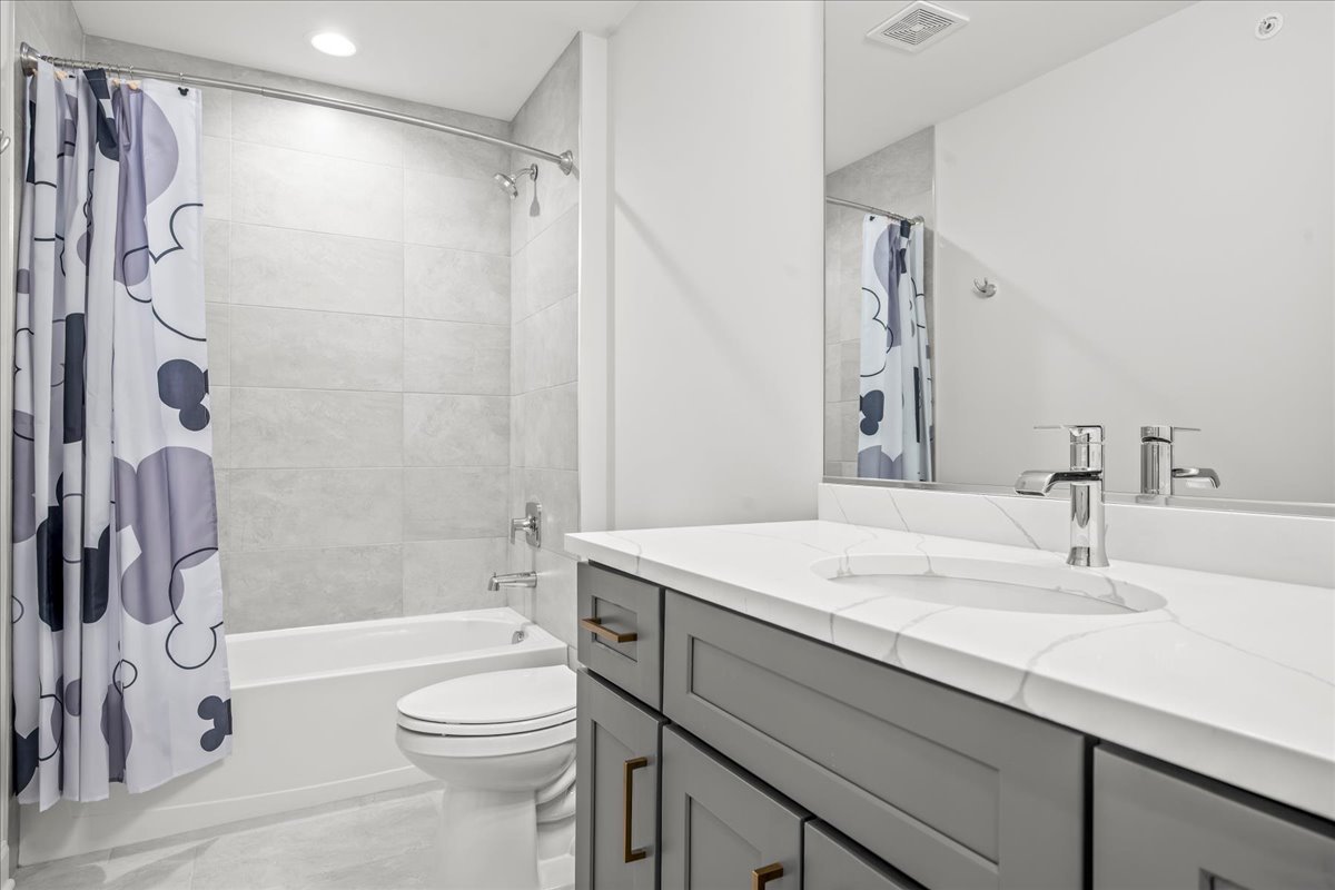 1229 Shermer Road Northbrook, IL 60062 - Photo 10 of 22 a bathroom with a sink a toilet and a bathtub