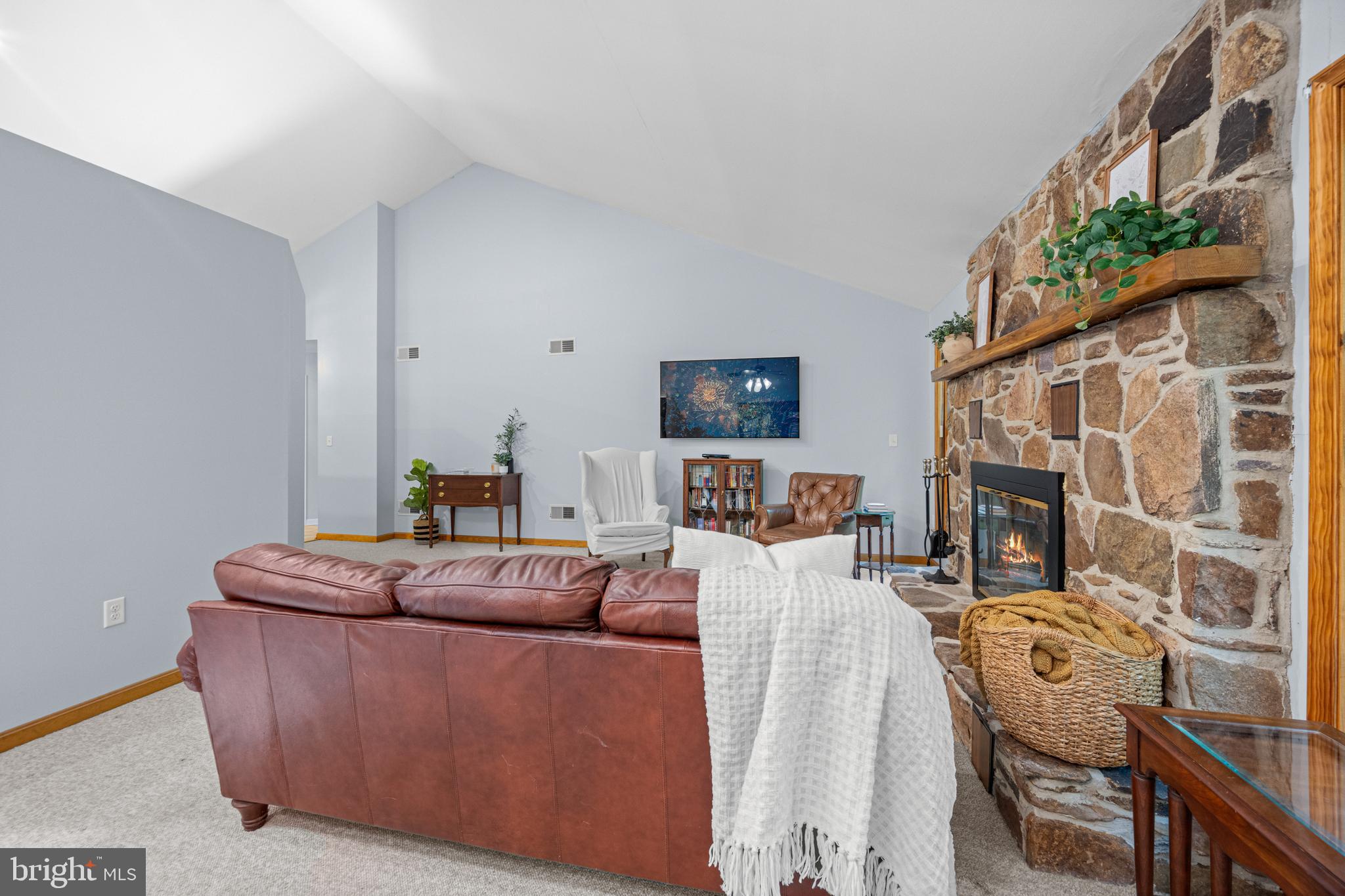 1160 Mt Hope Road Fairfield, PA 17320 - Photo 11 of 34 a living room with furniture a fireplace and a flat screen tv