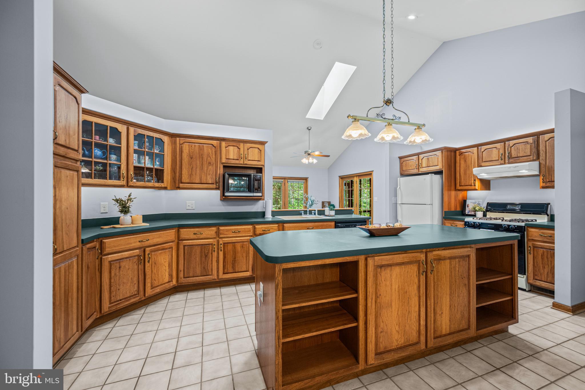 1160 Mt Hope Road Fairfield, PA 17320 - Photo 20 of 34 a kitchen with stainless steel appliances granite countertop a stove a sink and a refrigerator