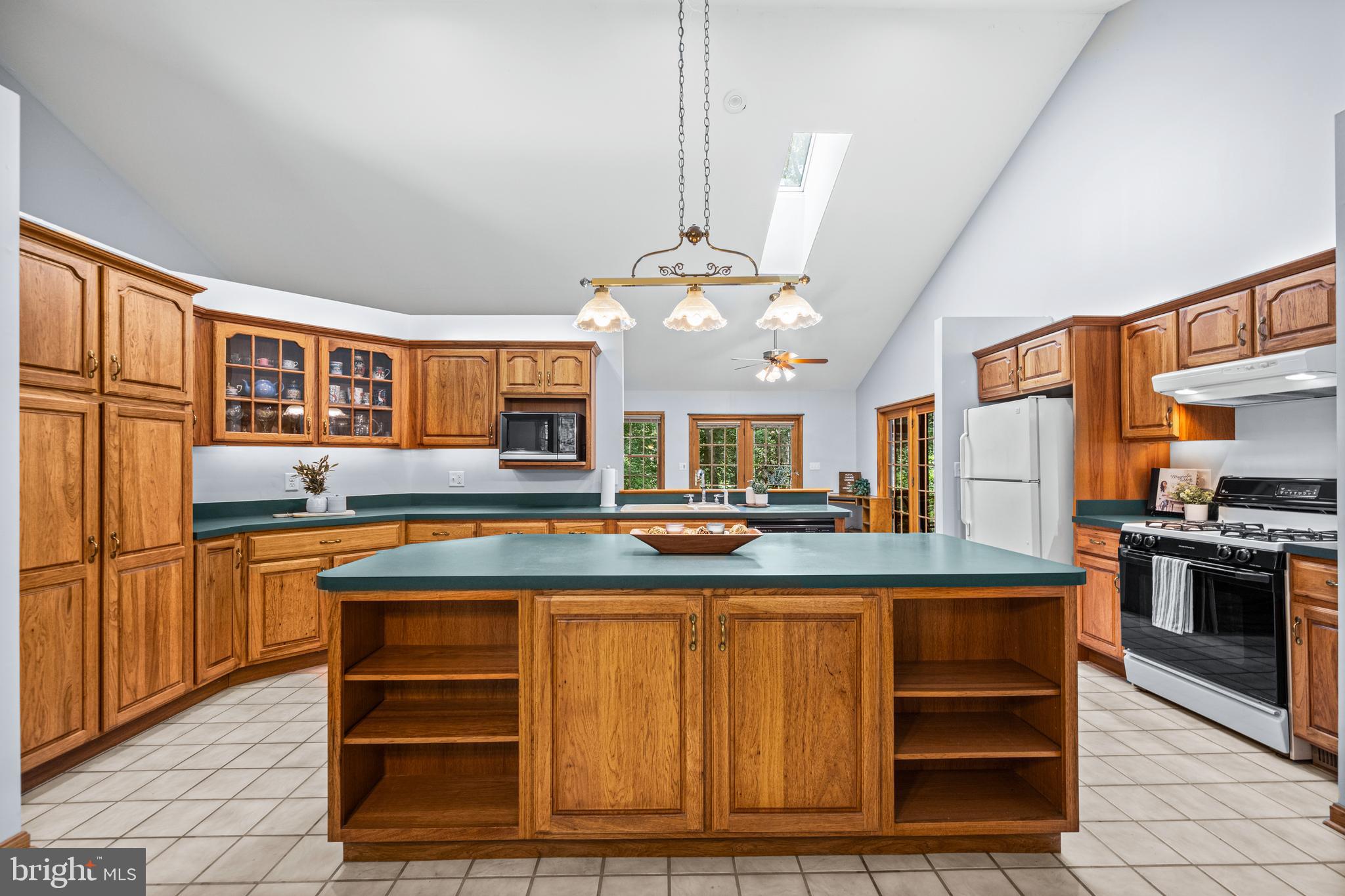 1160 Mt Hope Road Fairfield, PA 17320 - Photo 21 of 34 a kitchen with stainless steel appliances granite countertop a stove and a refrigerator