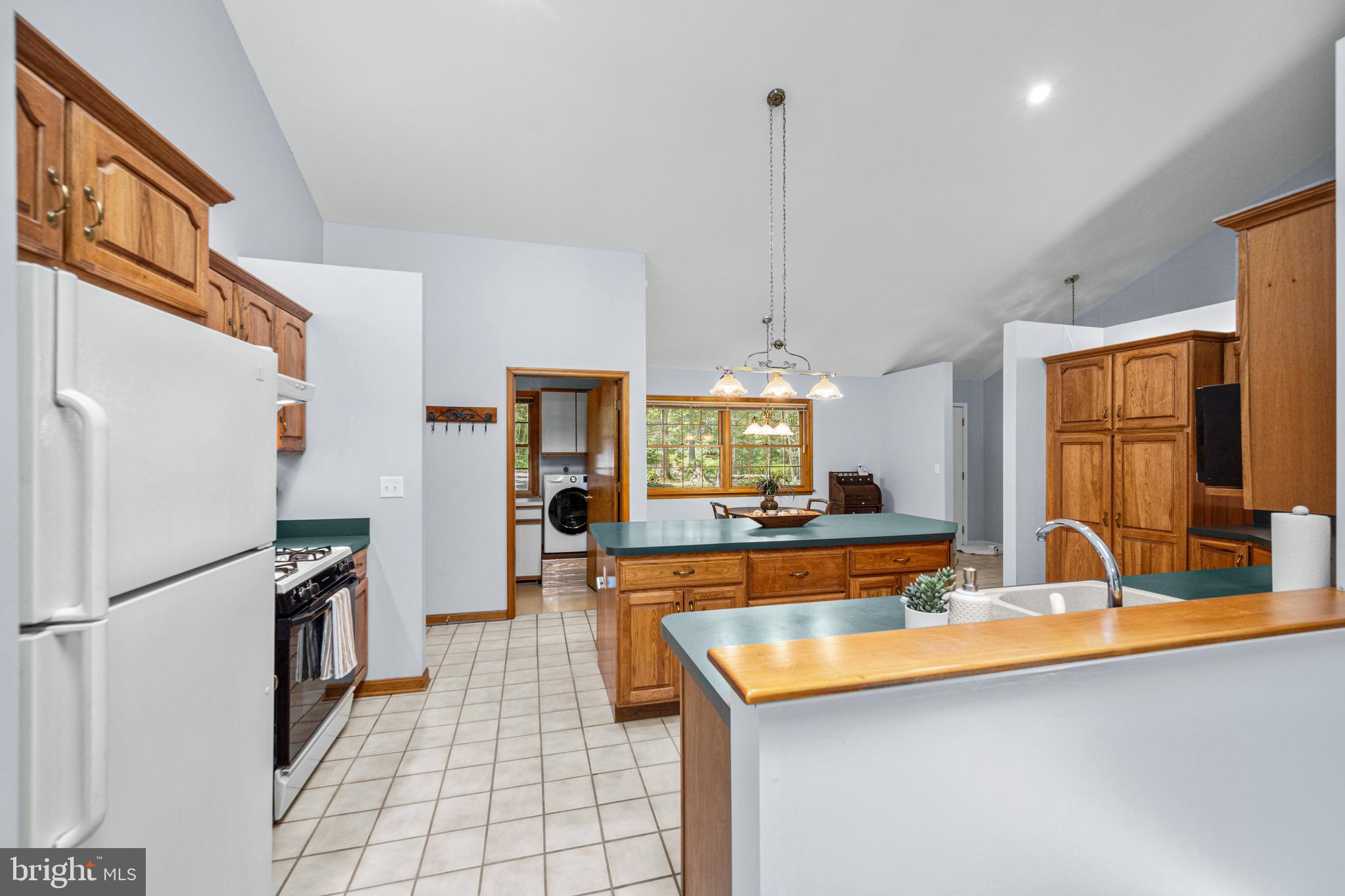 1160 Mt Hope Road Fairfield, PA 17320 - Photo 24 of 34 a kitchen with stainless steel appliances granite countertop a sink a stove and a refrigerator