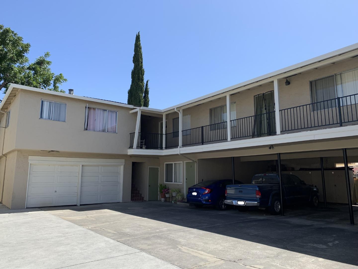 324 Camille Court, Unit 2 Mountain View, CA 94040 - Photo 1 of 9 a front view of a building with garage