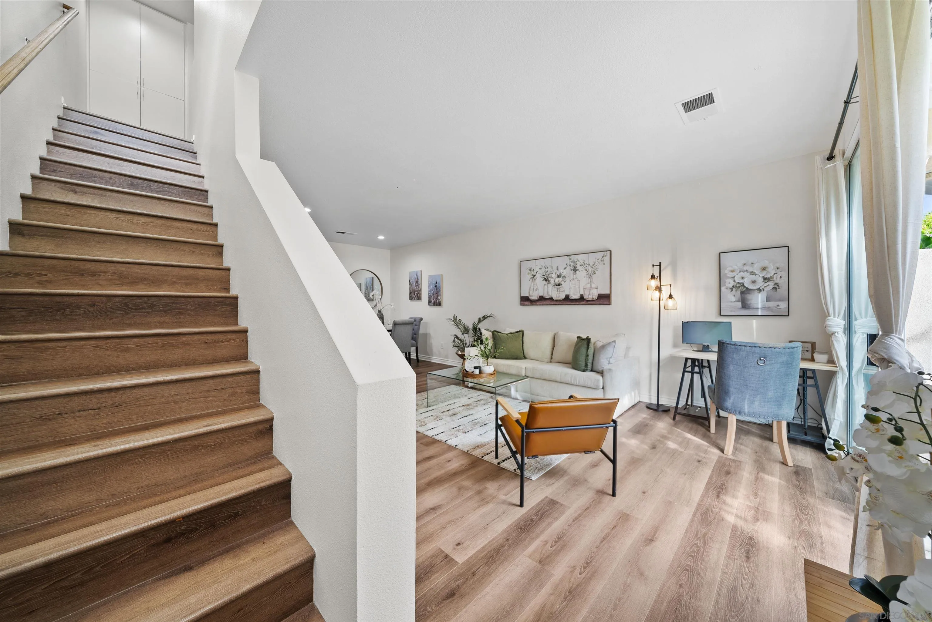 2291 Cabo Bahia Chula Vista, CA 91914 - Photo 17 of 45 a living room with furniture and a wooden floor