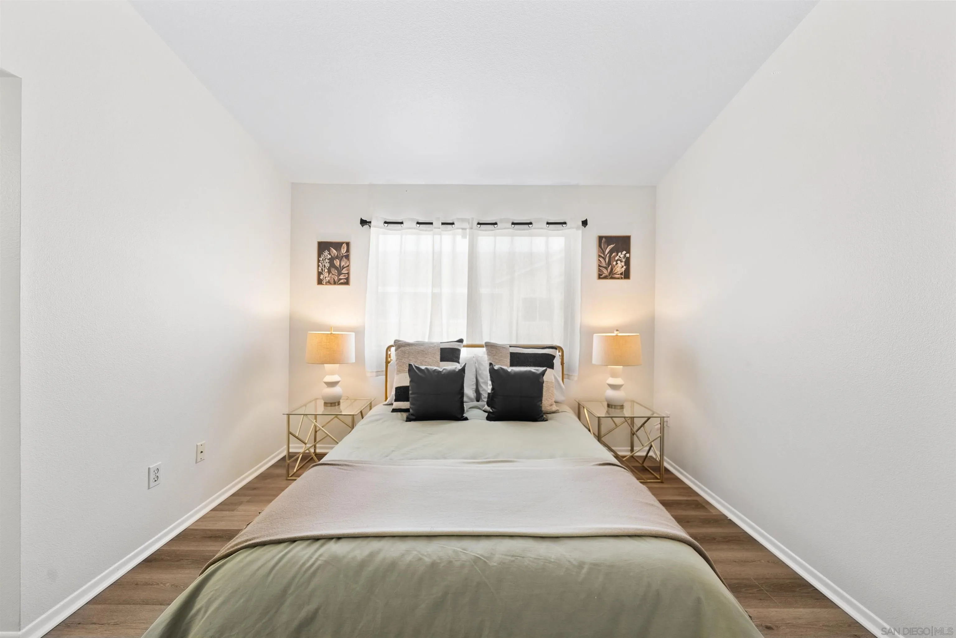 2291 Cabo Bahia Chula Vista, CA 91914 - Photo 19 of 45 a bedroom with a bed and a large mirror