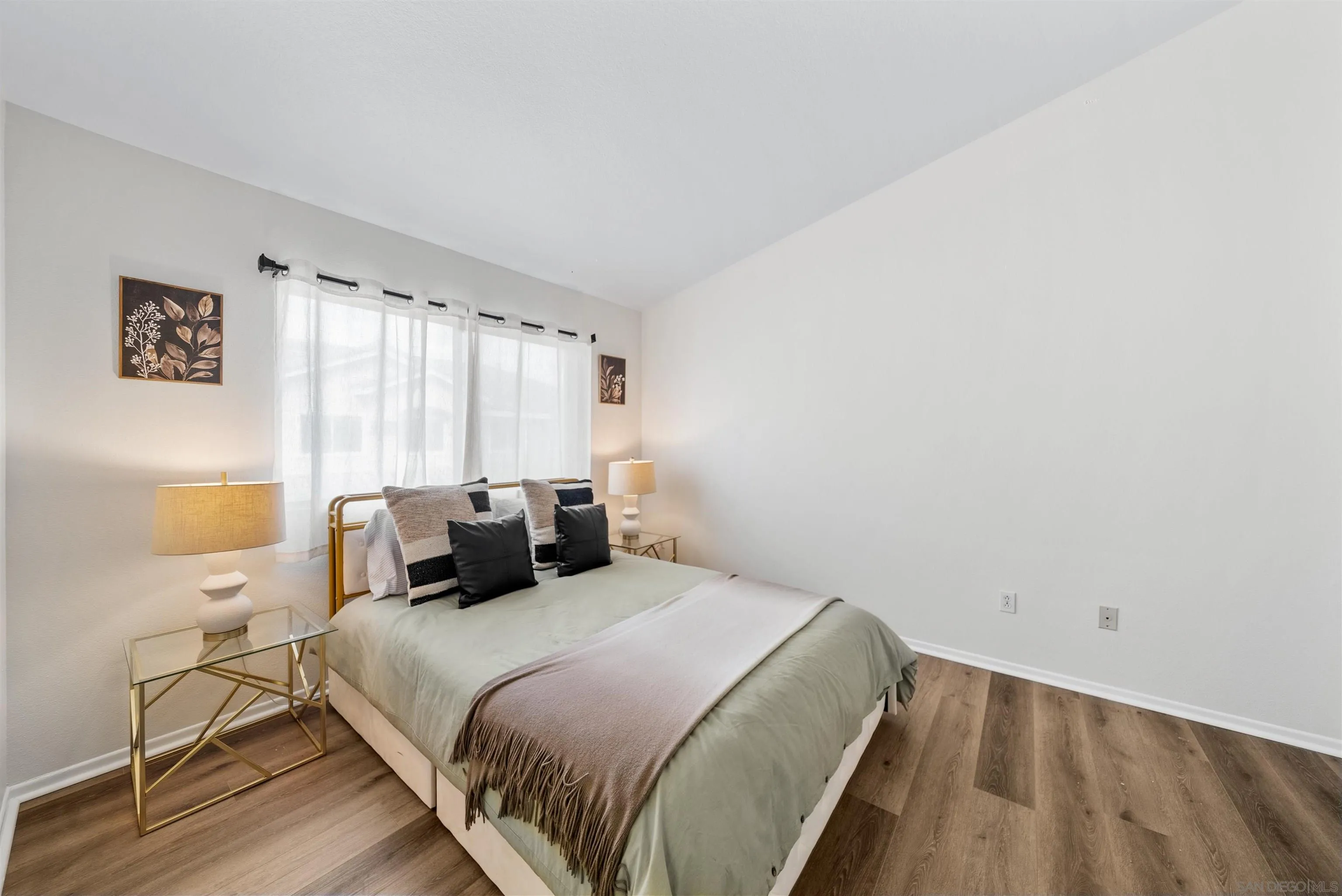 2291 Cabo Bahia Chula Vista, CA 91914 - Photo 20 of 45 a bedroom with a bed and a window