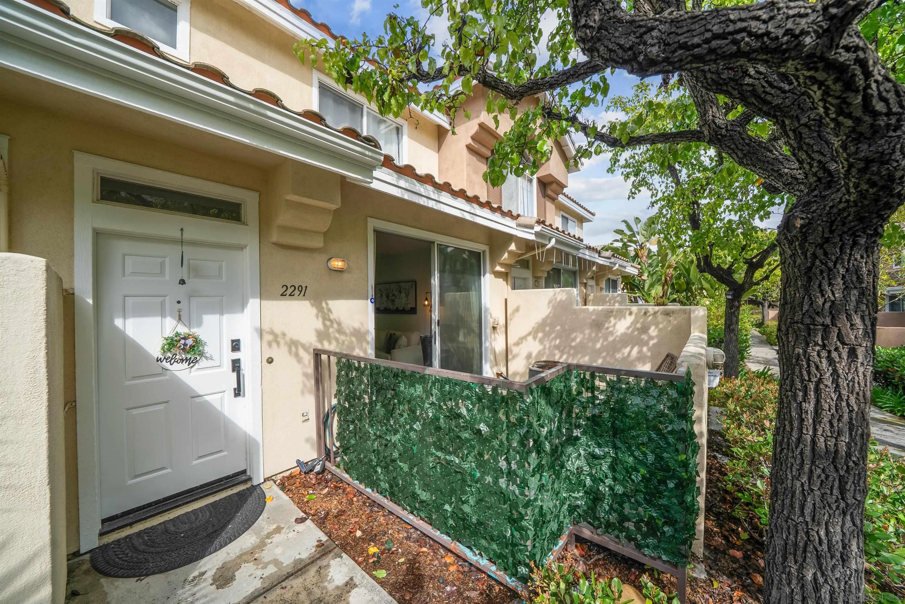 2291 Cabo Bahia Chula Vista, CA 91914 - Photo 2 of 45 a view of a porch with a tree