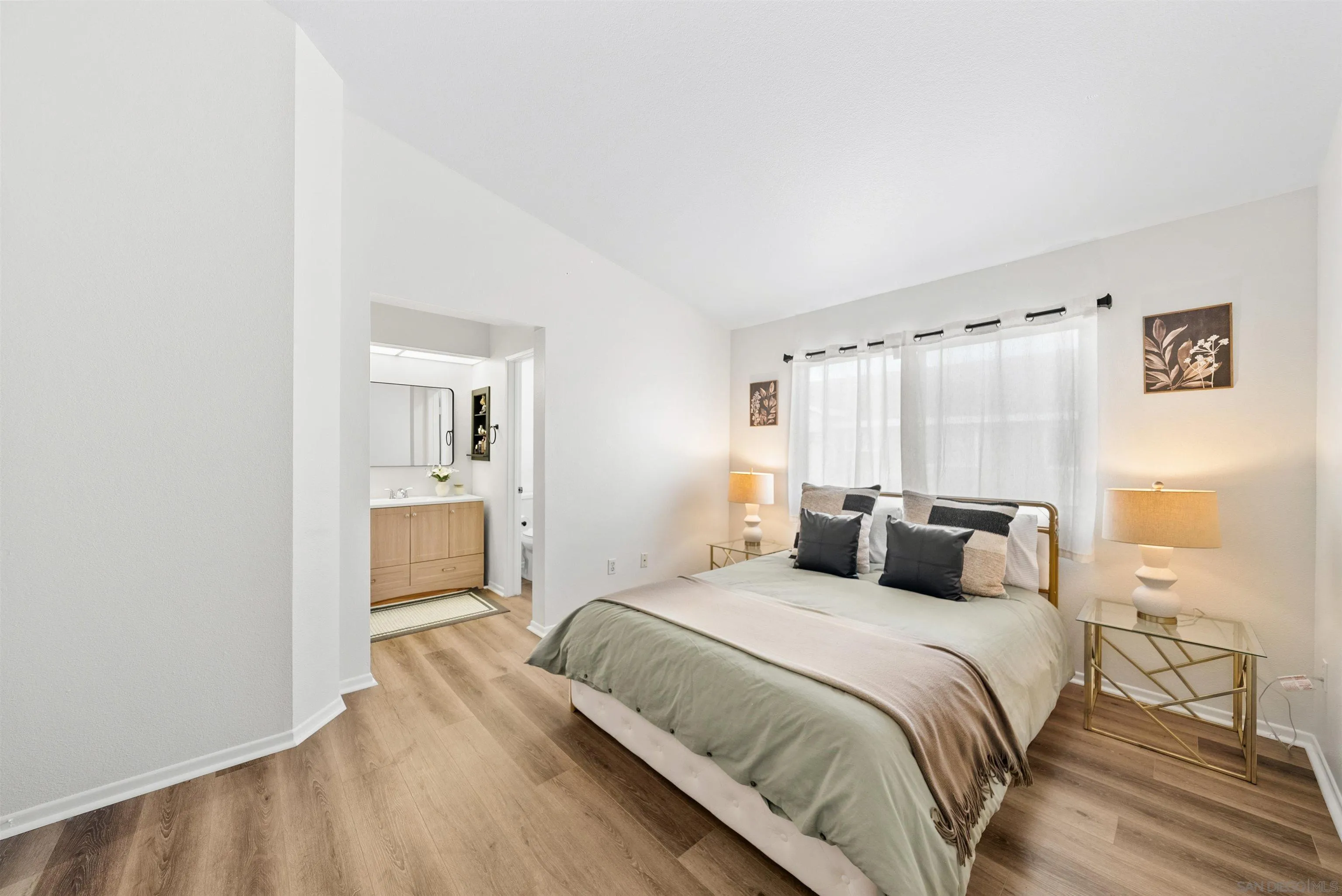 2291 Cabo Bahia Chula Vista, CA 91914 - Photo 21 of 45 a bedroom with a bed and a view of bathroom