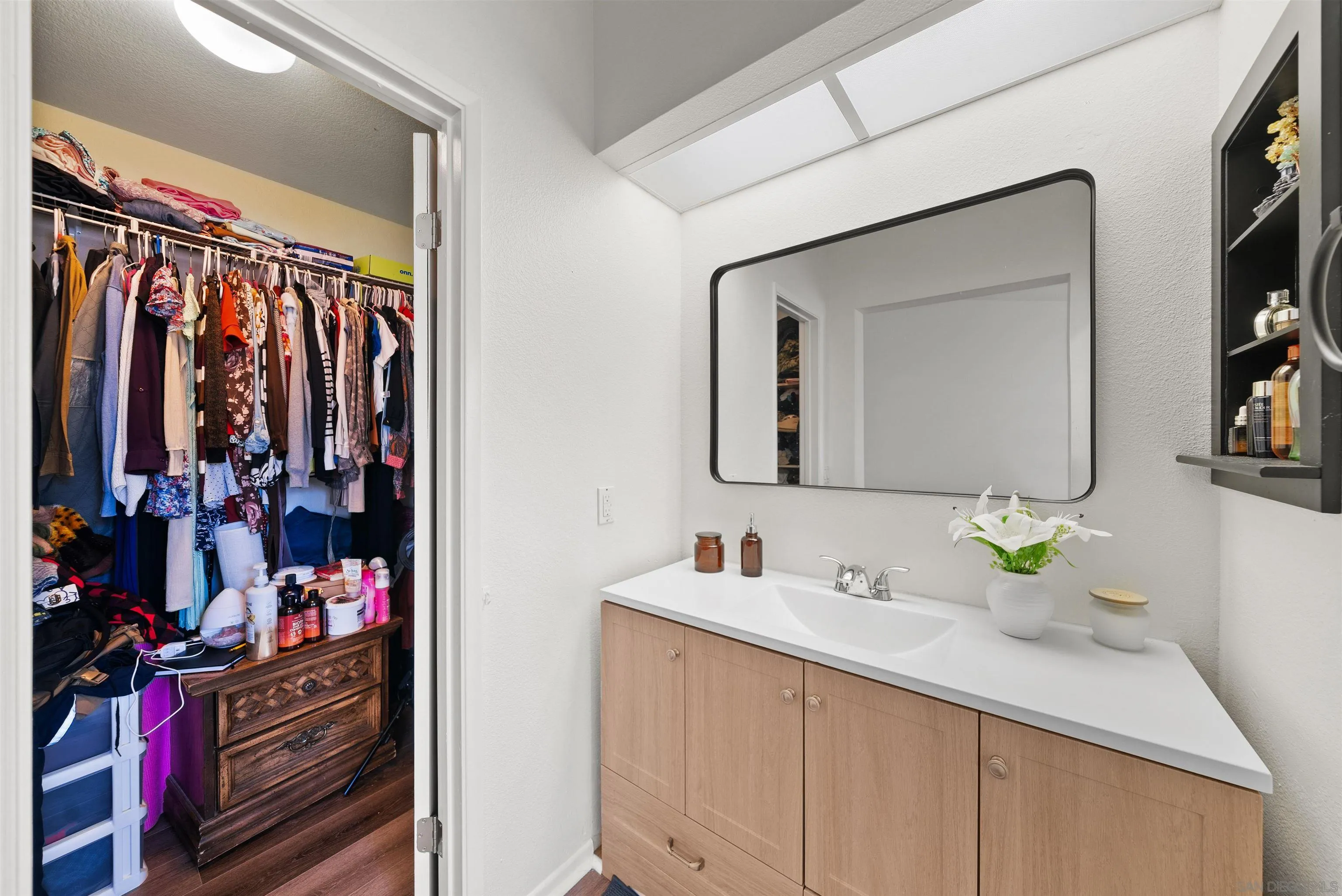 2291 Cabo Bahia Chula Vista, CA 91914 - Photo 25 of 45 a bathroom with a sink vanity and mirror