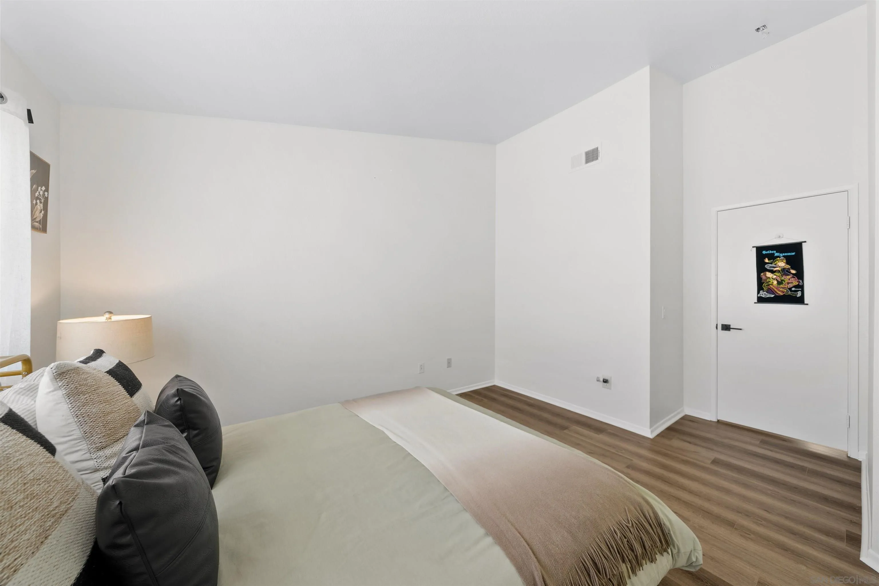 2291 Cabo Bahia Chula Vista, CA 91914 - Photo 26 of 45 a bedroom with a bed and a lamp