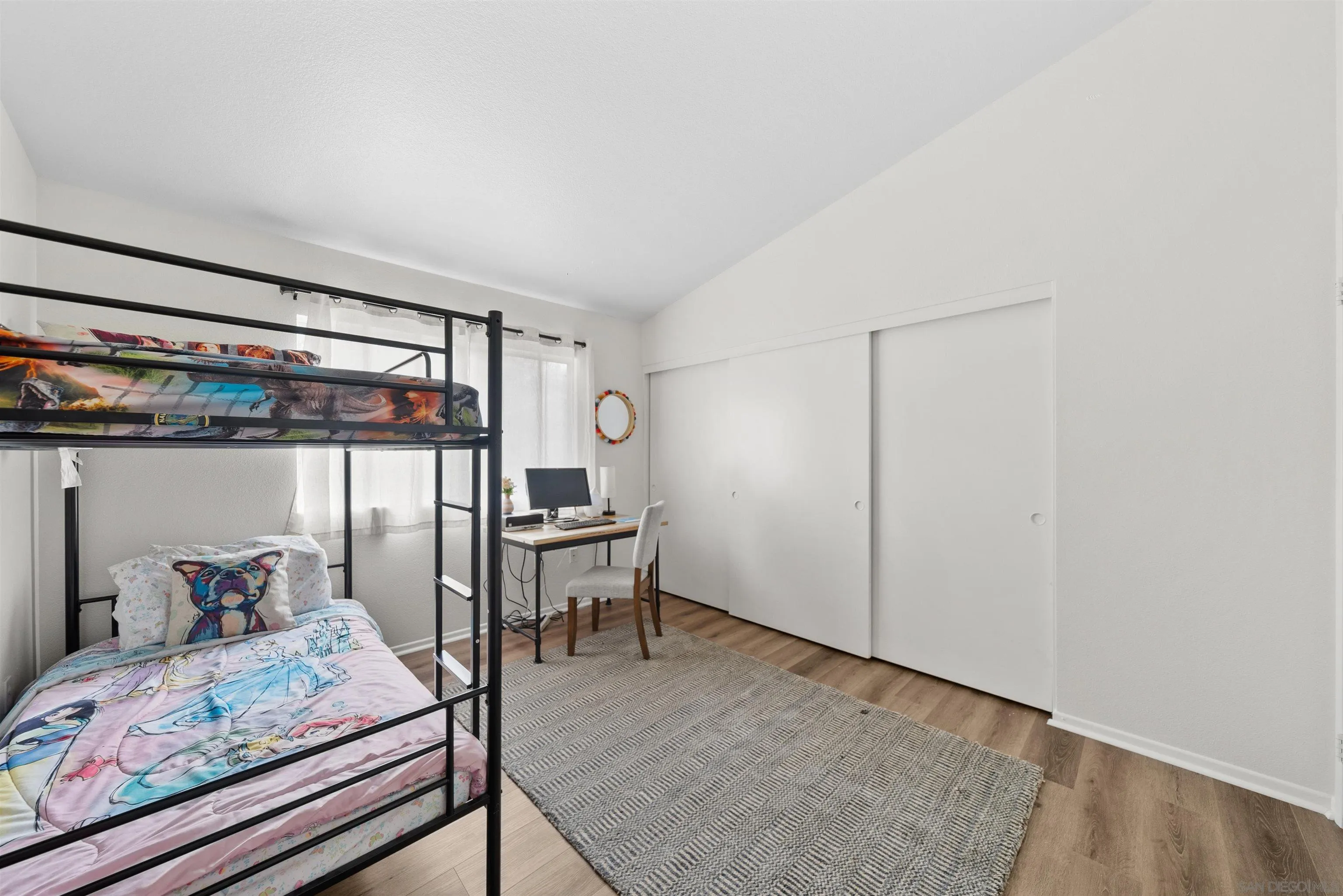 2291 Cabo Bahia Chula Vista, CA 91914 - Photo 29 of 45 a bedroom with a bed and a table in it