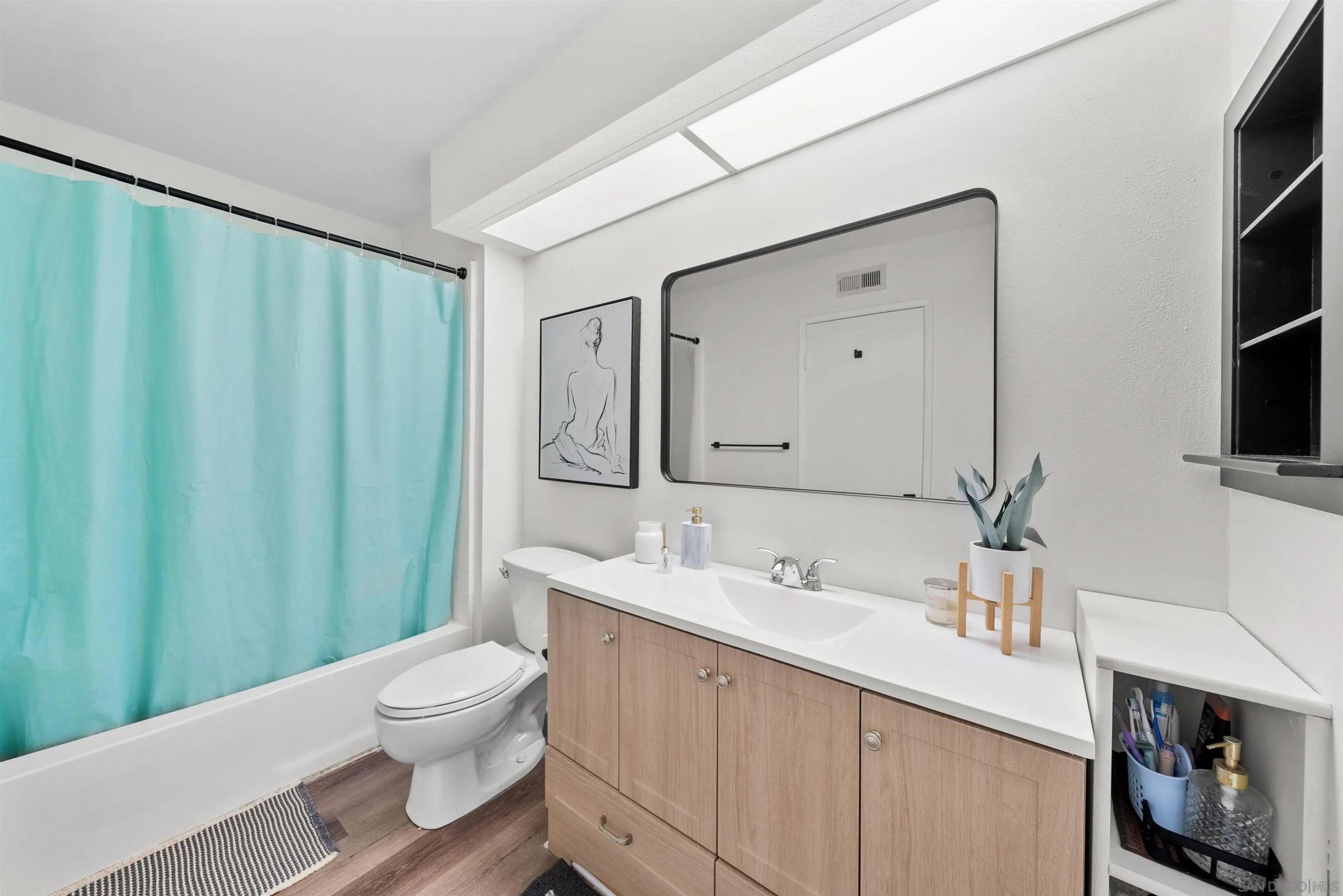 2291 Cabo Bahia Chula Vista, CA 91914 - Photo 30 of 45 a bathroom with a sink a toilet and shower