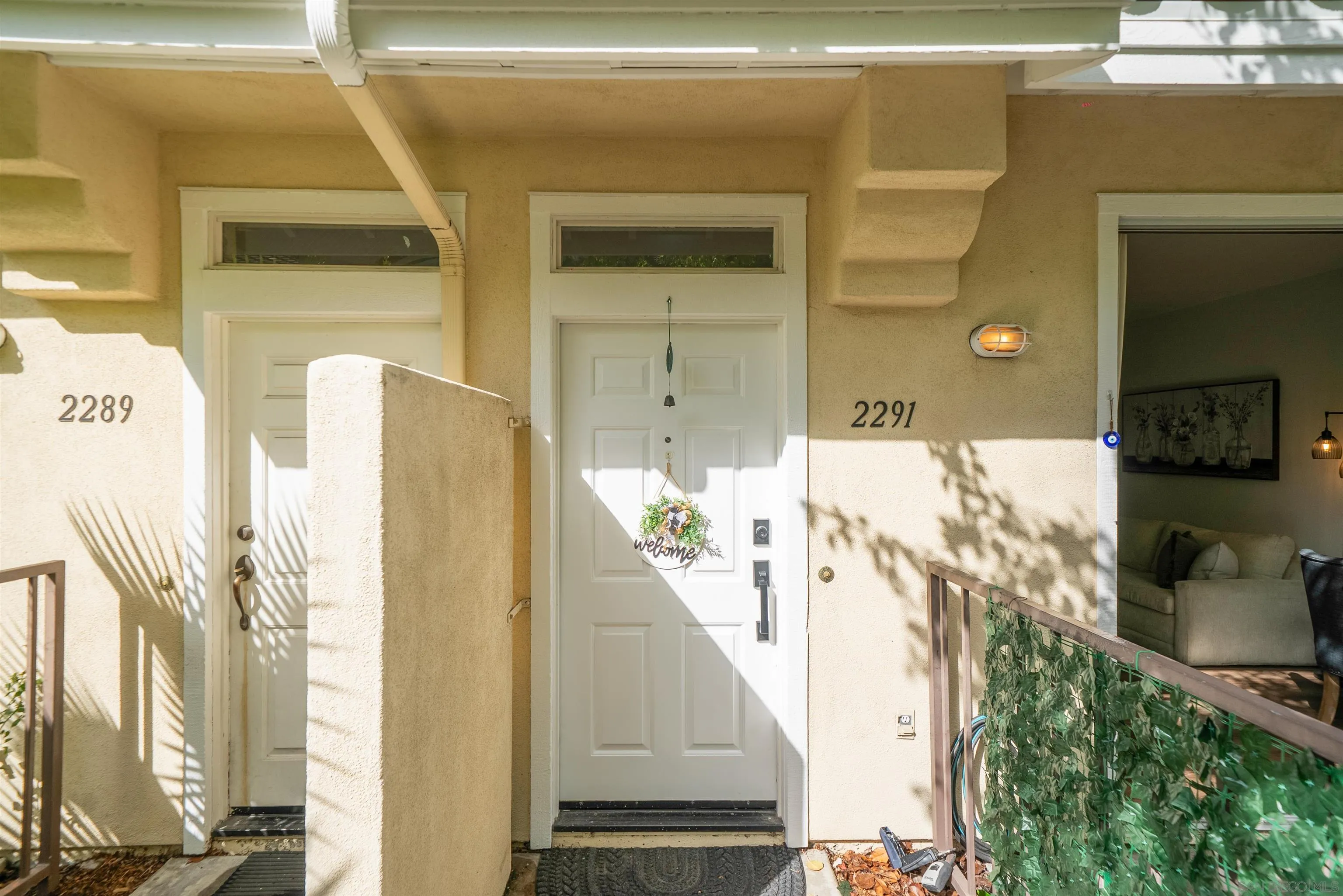 2291 Cabo Bahia Chula Vista, CA 91914 - Photo 32 of 45 a view of a hallway with a white door and a window
