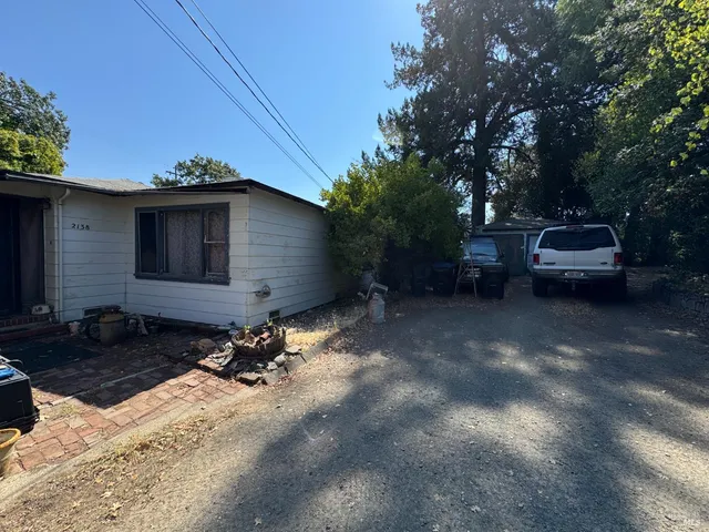 a view of house with backyard