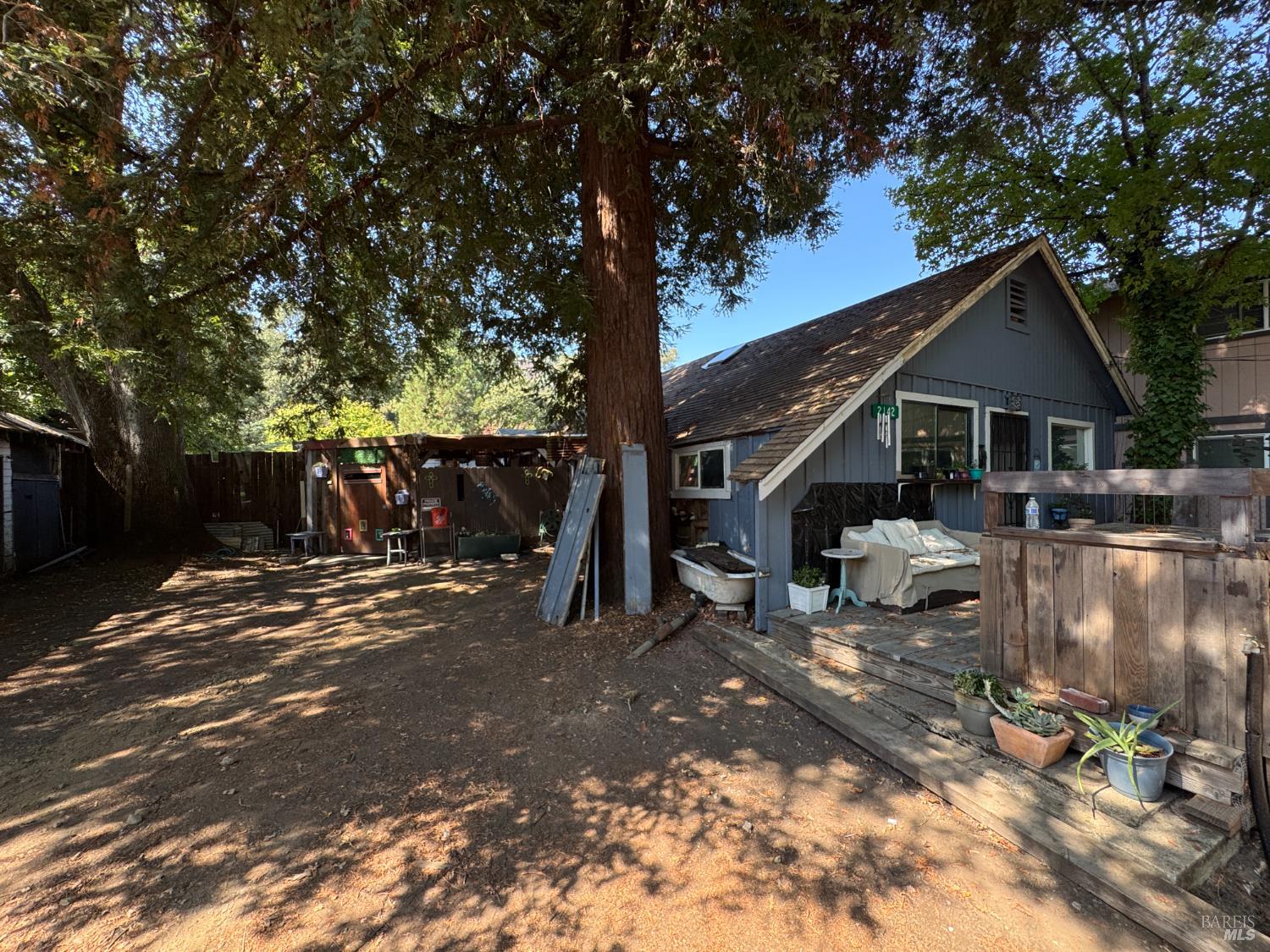 2140 South State Street Ukiah, CA 95482 - Photo 24 of 67 a view of a house with large tree and wooden fence
