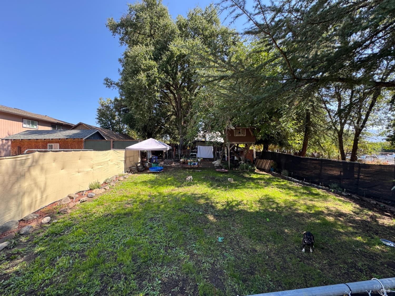 2140 South State Street Ukiah, CA 95482 - Photo 27 of 67 a backyard of a house with yard and outdoor seating