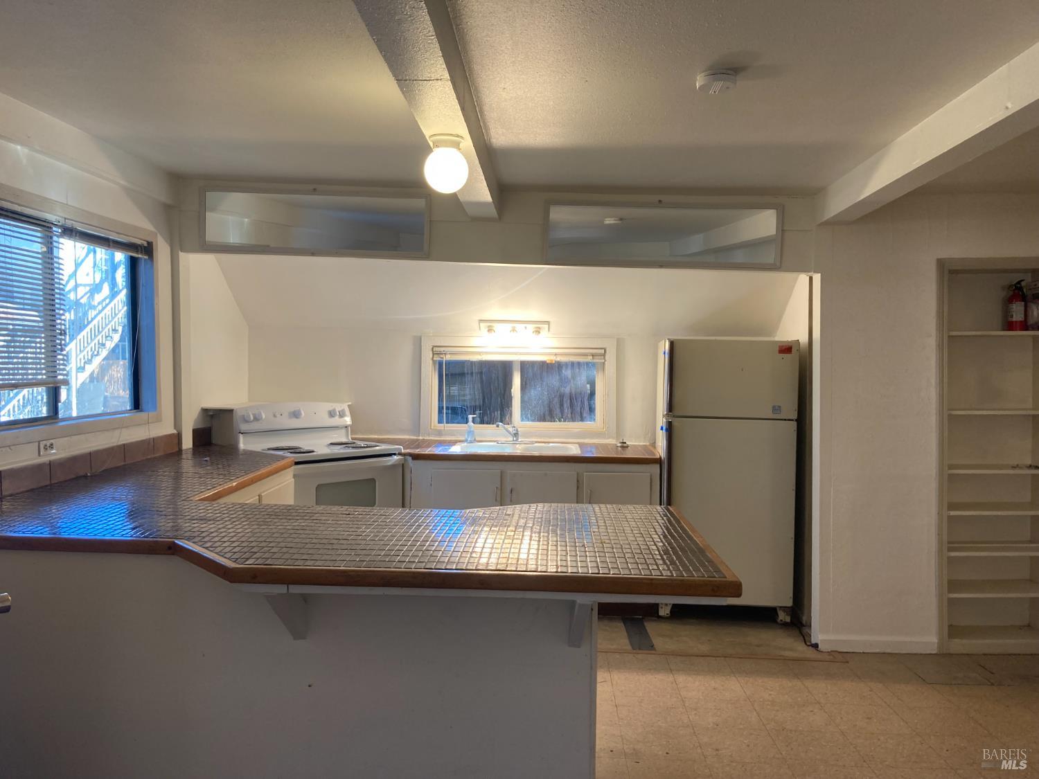 2140 South State Street Ukiah, CA 95482 - Photo 38 of 67 a kitchen with a sink and a refrigerator
