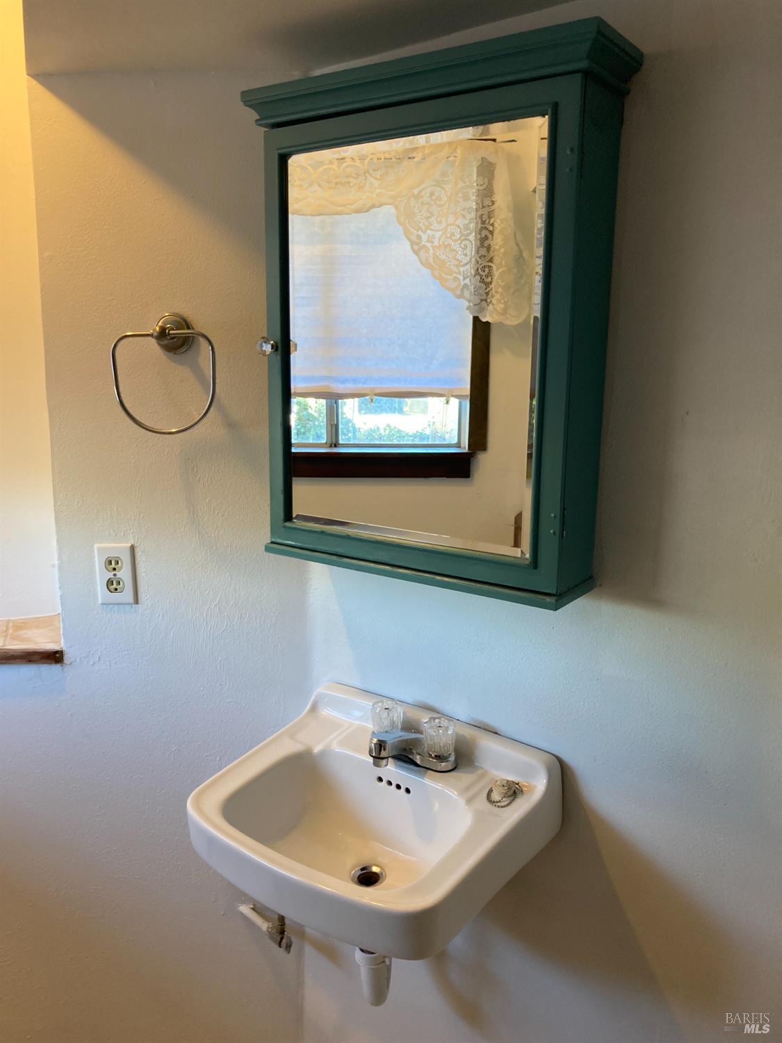 2140 South State Street Ukiah, CA 95482 - Photo 53 of 67 a bathroom with a sink and a mirror
