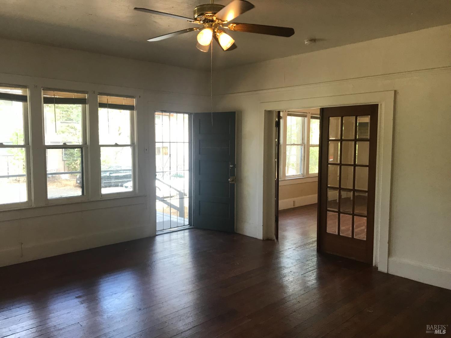 2140 South State Street Ukiah, CA 95482 - Photo 54 of 67 an empty room with wooden floor and windows