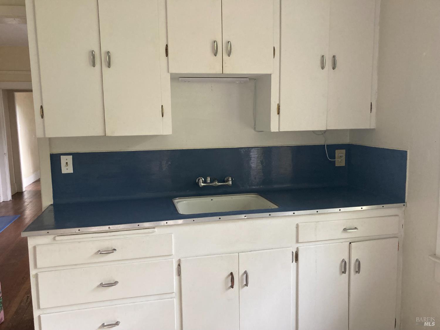 2140 South State Street Ukiah, CA 95482 - Photo 64 of 67 a kitchen with granite countertop white cabinets and white appliances