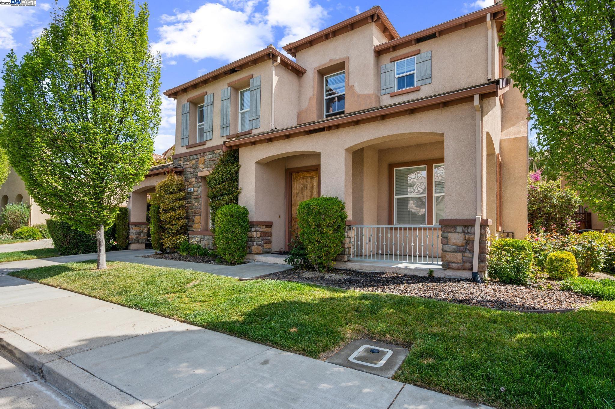 front view of a house with a yard