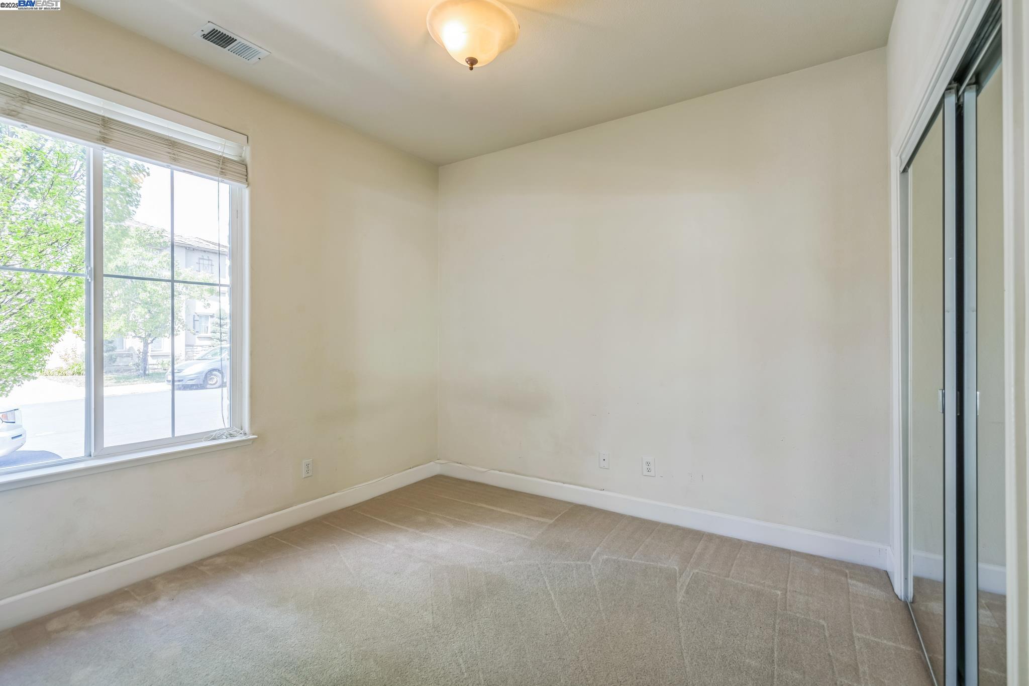 5591 Newfields Lane Dublin, CA 94568 - Photo 16 of 24 an empty room with a window