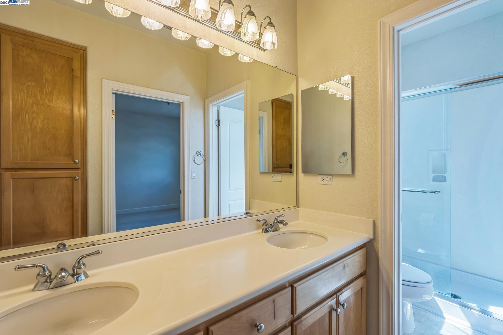 5591 Newfields Lane Dublin, CA 94568 - Photo 17 of 24 a bathroom with a sink and a mirror