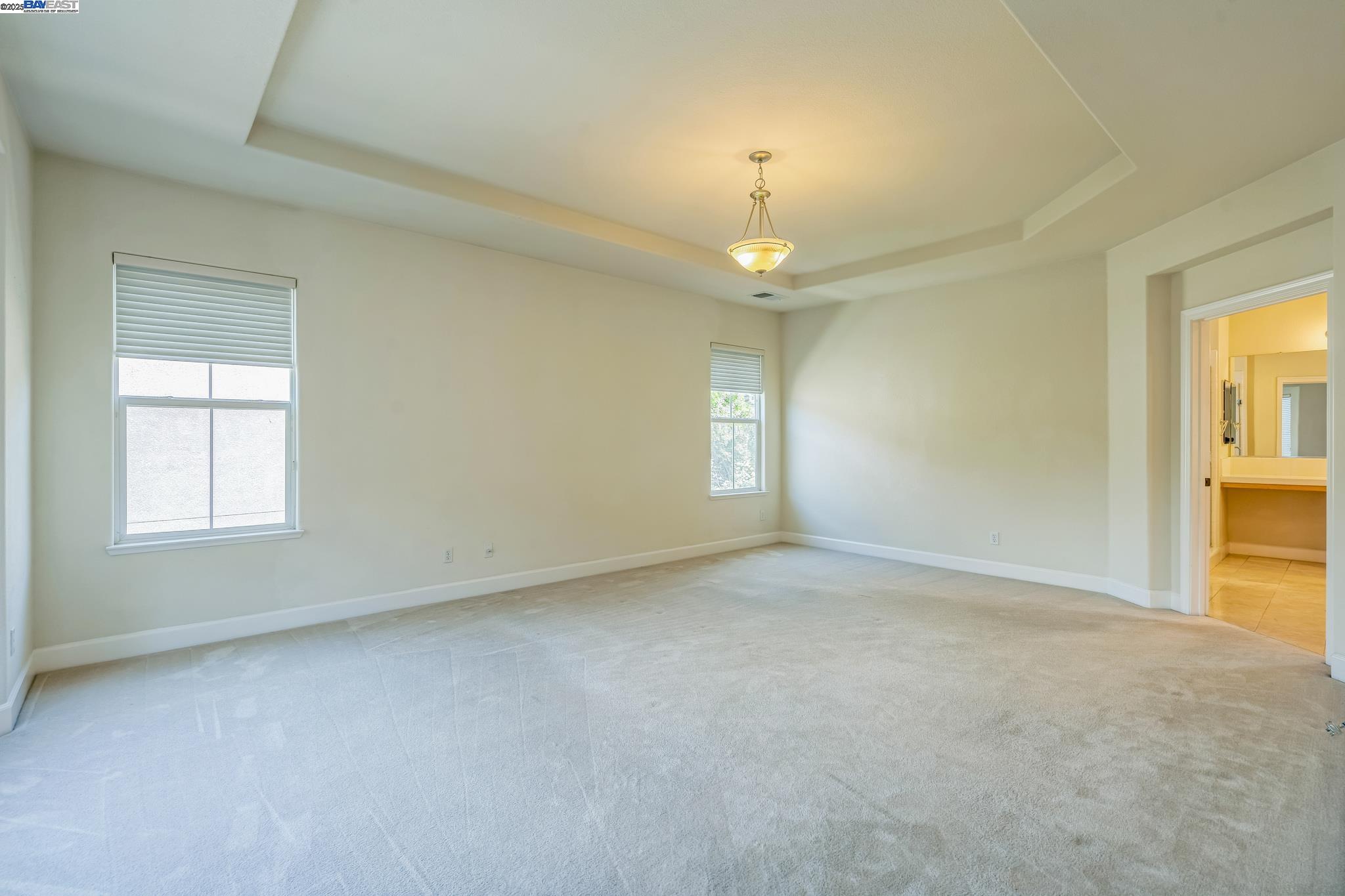 5591 Newfields Lane Dublin, CA 94568 - Photo 18 of 24 an empty room with windows and chandelier