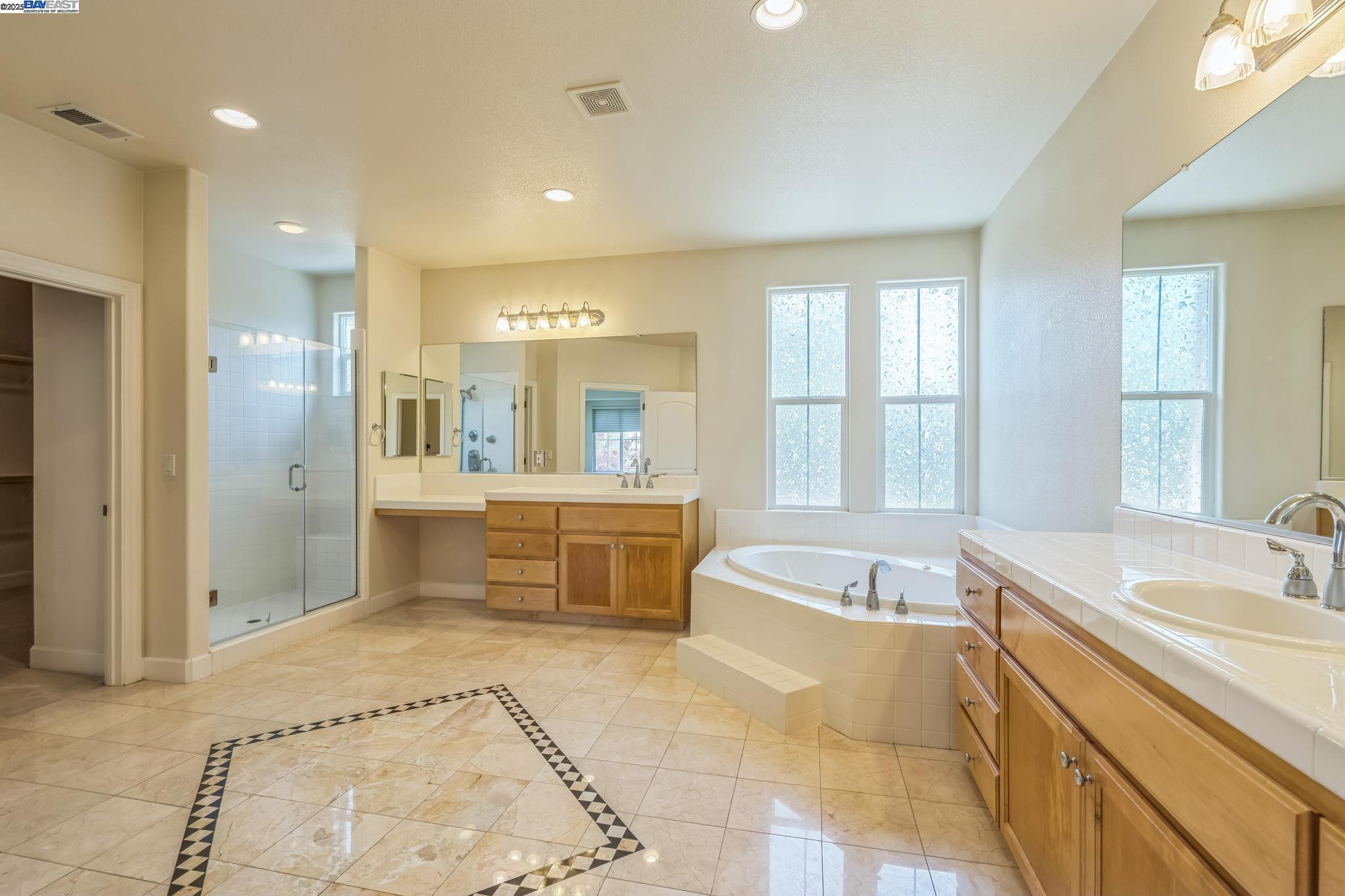 5591 Newfields Lane Dublin, CA 94568 - Photo 19 of 24 a spacious bathroom with a tub sink shower and mirror