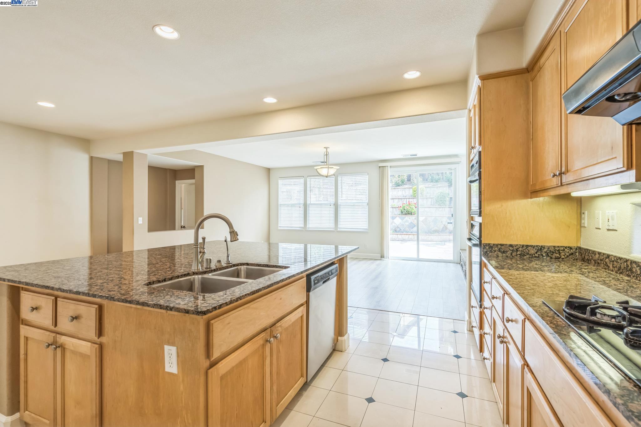 5591 Newfields Lane Dublin, CA 94568 - Photo 7 of 24 a kitchen that has a sink and a stove