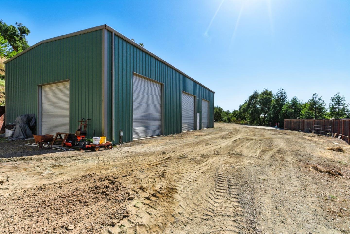 12725 Old La Honda Road Woodside, CA 94062 - Photo 20 of 30 a view of a house with backyard and trees