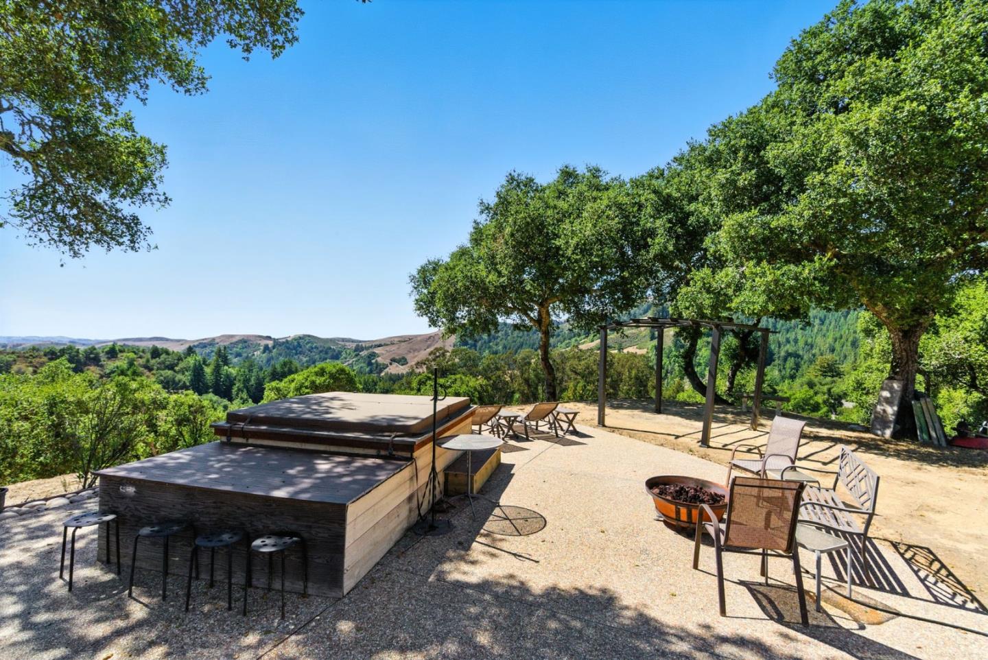 12725 Old La Honda Road Woodside, CA 94062 - Photo 2 of 30 a view of house with backyard and sitting area