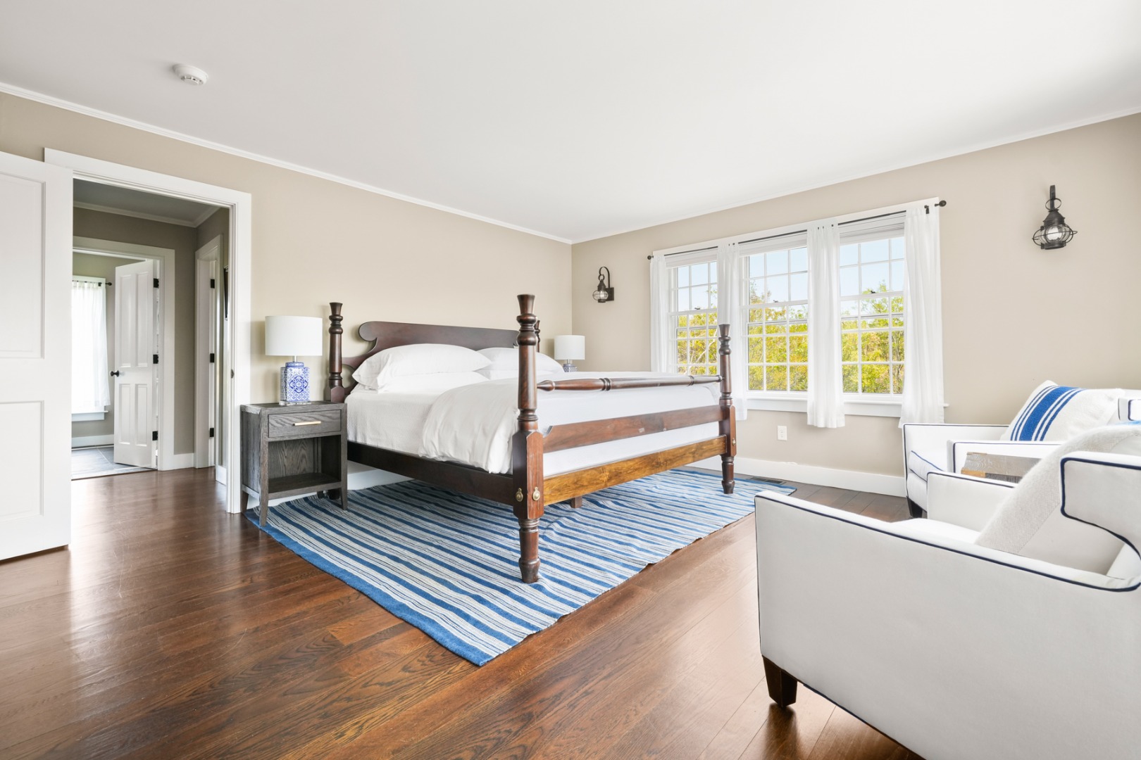 21 Quidnet Road Nantucket, MA 02554 - Photo 44 of 62 a spacious bedroom with a bed and a large window