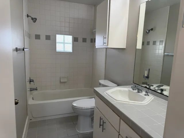a bathroom with a bathtub and toilet