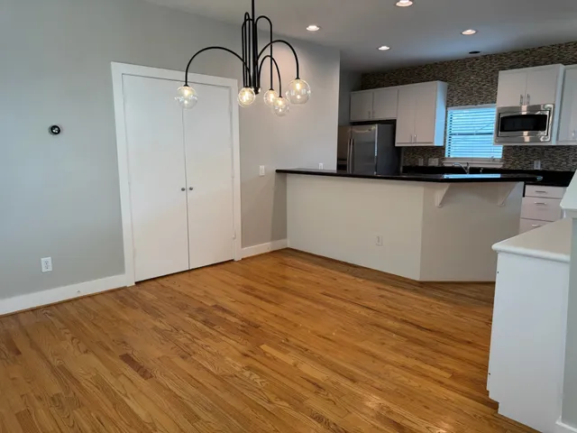 a kitchen with a stove and a refrigerator