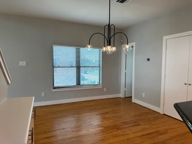 a room with a closet and wooden floor